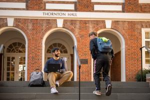 Two students outside of the entrance to Thornton Hall