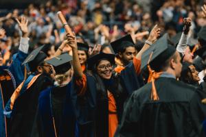 A student celebrates at the diploma ceremony