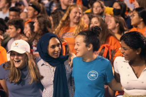 Students celebrating at a family weekend football game